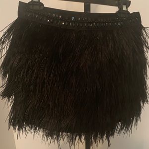 Express feathered w/stones skirt